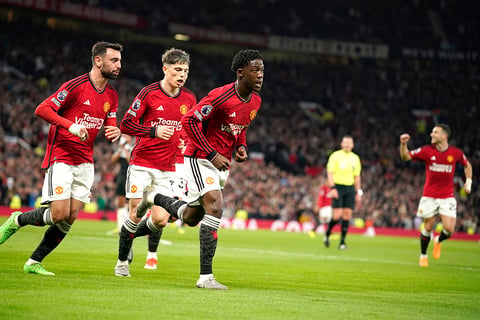 Man United's players celebrate team's first goal